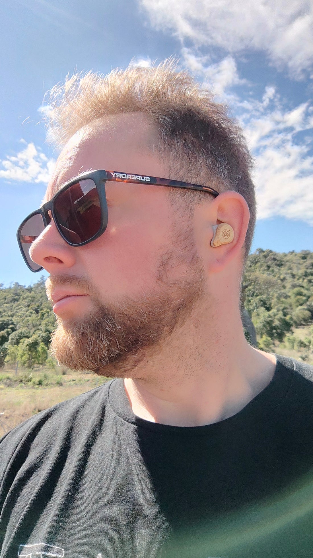 Man wearing We Pure PureBuds on Aussie farm