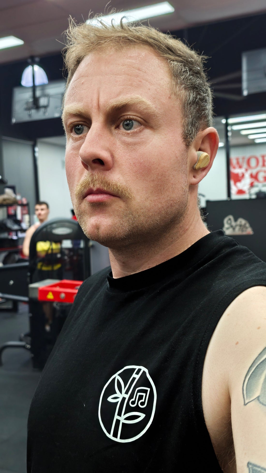 Man wearing PureBuds Pro earbuds in the gym