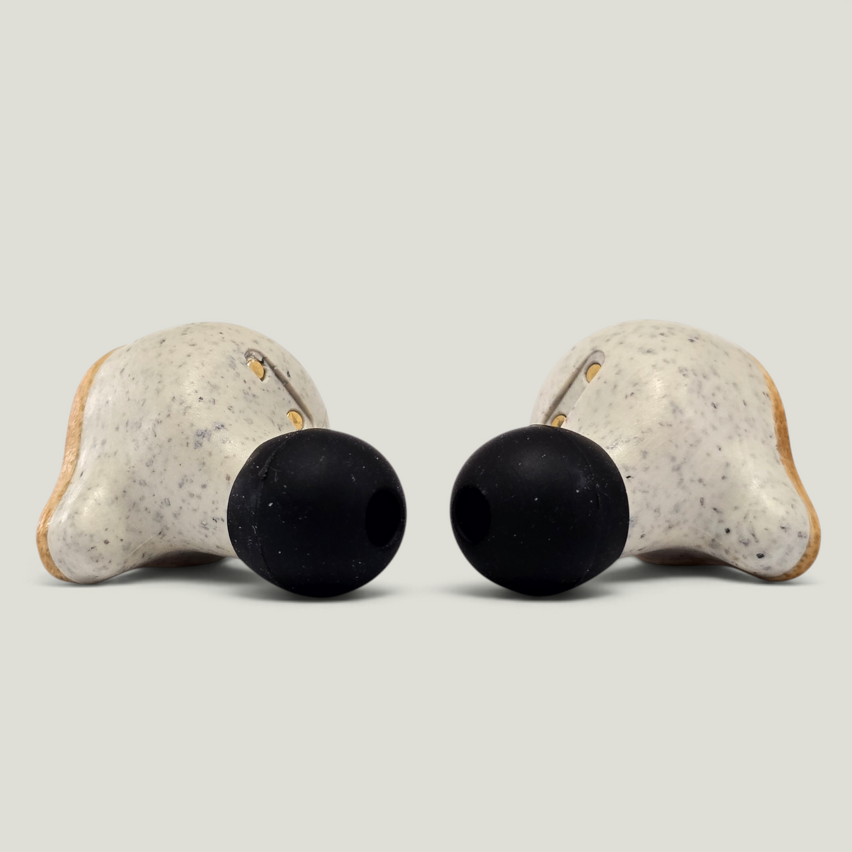 Pair of PureBuds Pro earbuds, showing silicone ear tips and wheat straw plastic close up