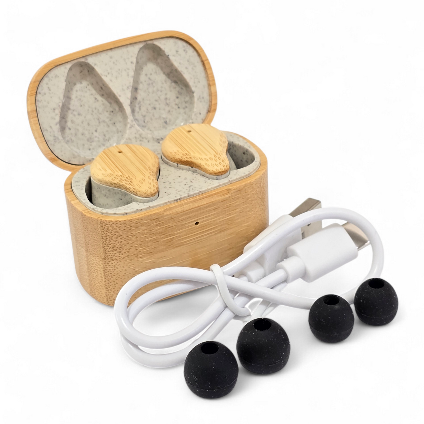 Wooden earbud case with wireless earbuds and charging cable on a white background