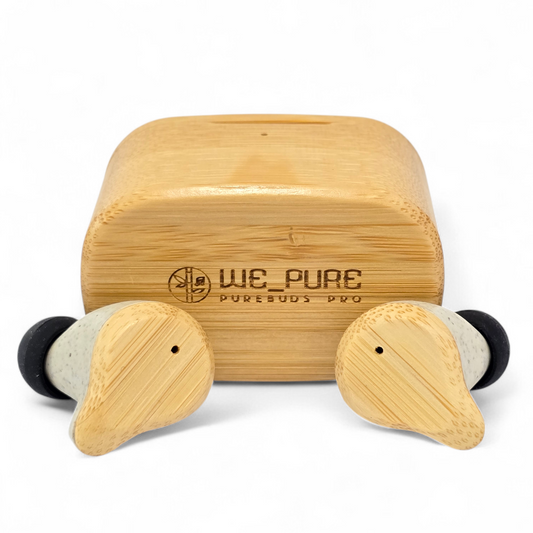 Wooden earbud case with two earbuds in front on a white background