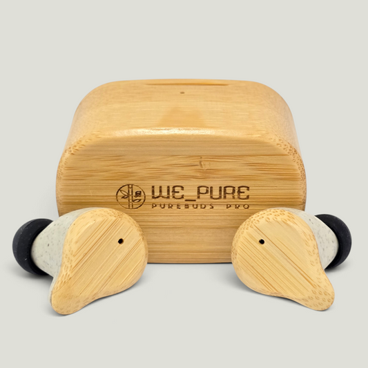 PureBuds Pro Bamboo earbud case with two earbuds in front on a white background