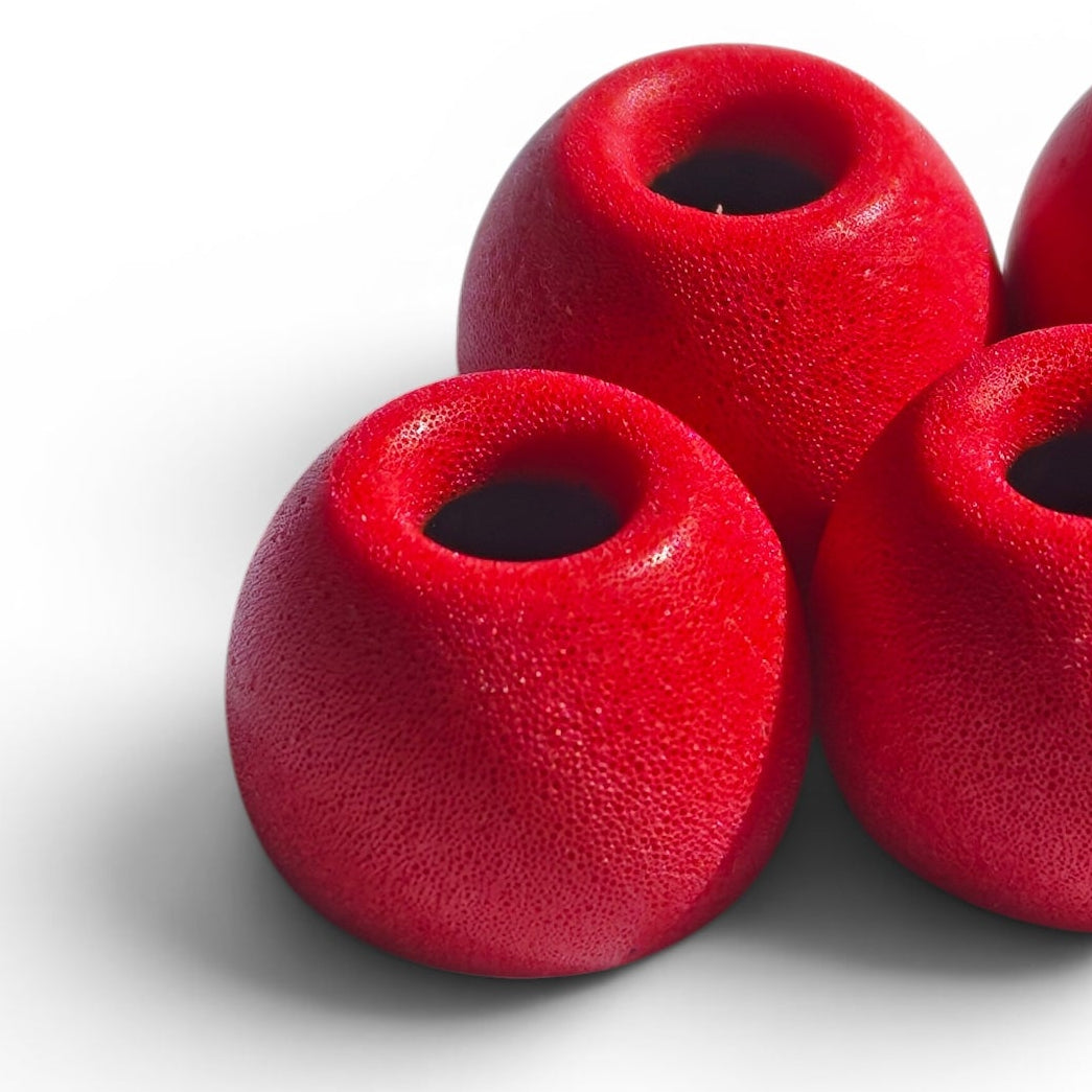 Close-up of PureSeal red memory foam ear tips showing the foam texture