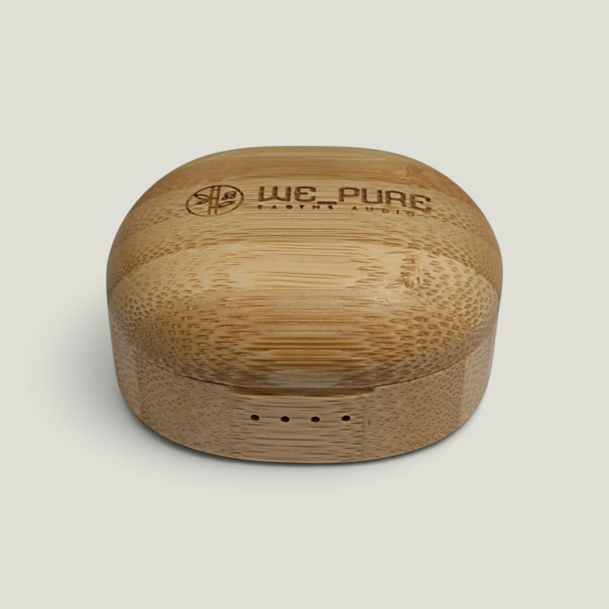 We Pure bamboo charging case for PurePods earbuds with natural wood grain texture and engraved brand logo.