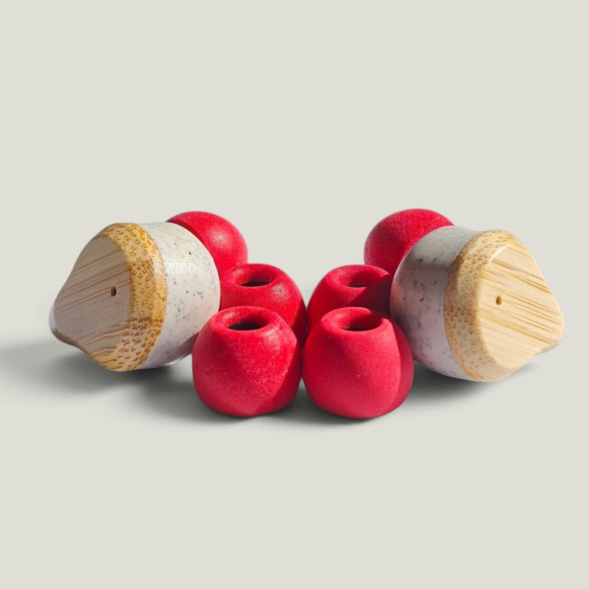 We Pure memory foam ear tips in Tradie Red with two earbud attachments for a secure, noise-blocking fit.