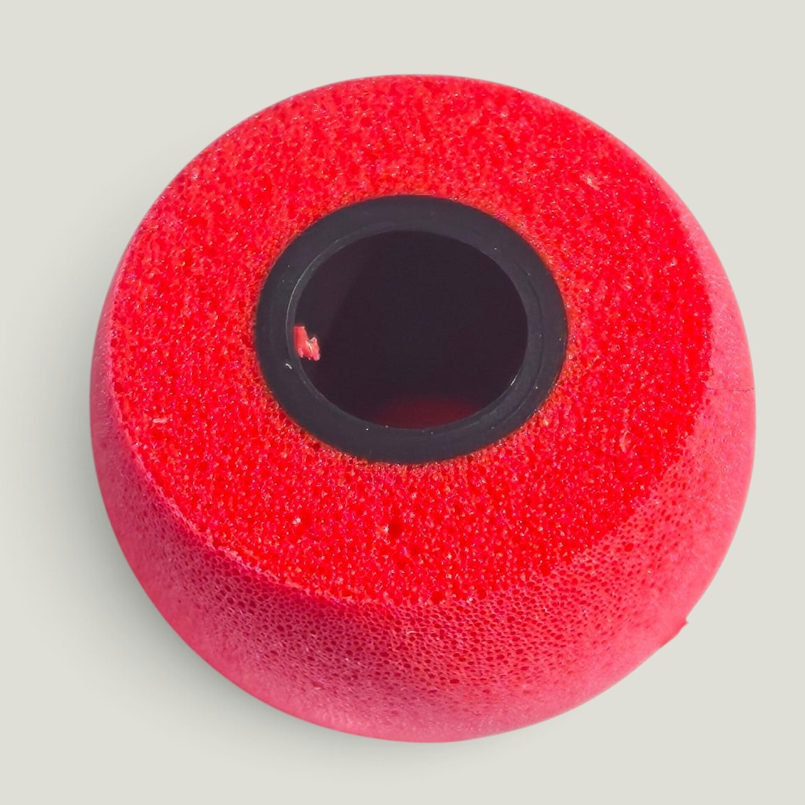 We Pure PureSeal memory foam ear tip in Tradie Red with a black inner core for noise isolation