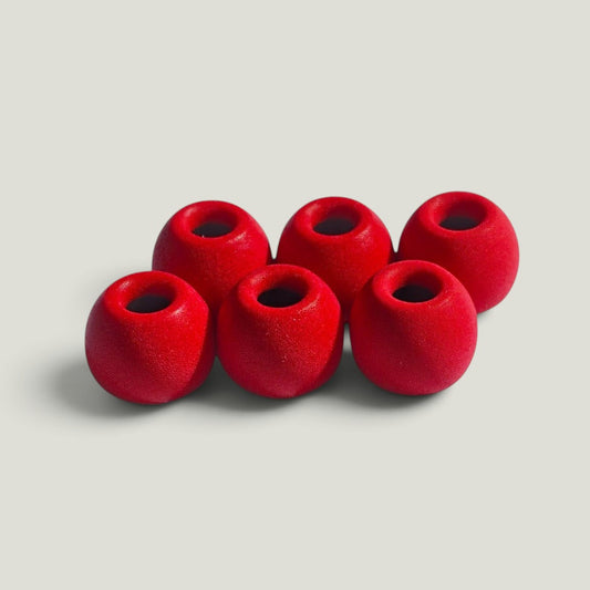 Three pairs of We Pure PureSeal memory foam ear tips in Tradie Red, designed for a secure noise-blocking seal.