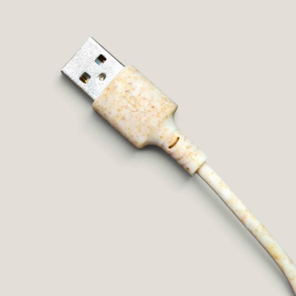 We Pure 1m USB-C charging cable made from sustainable speckled wheat straw plastic with a beige textured finish
