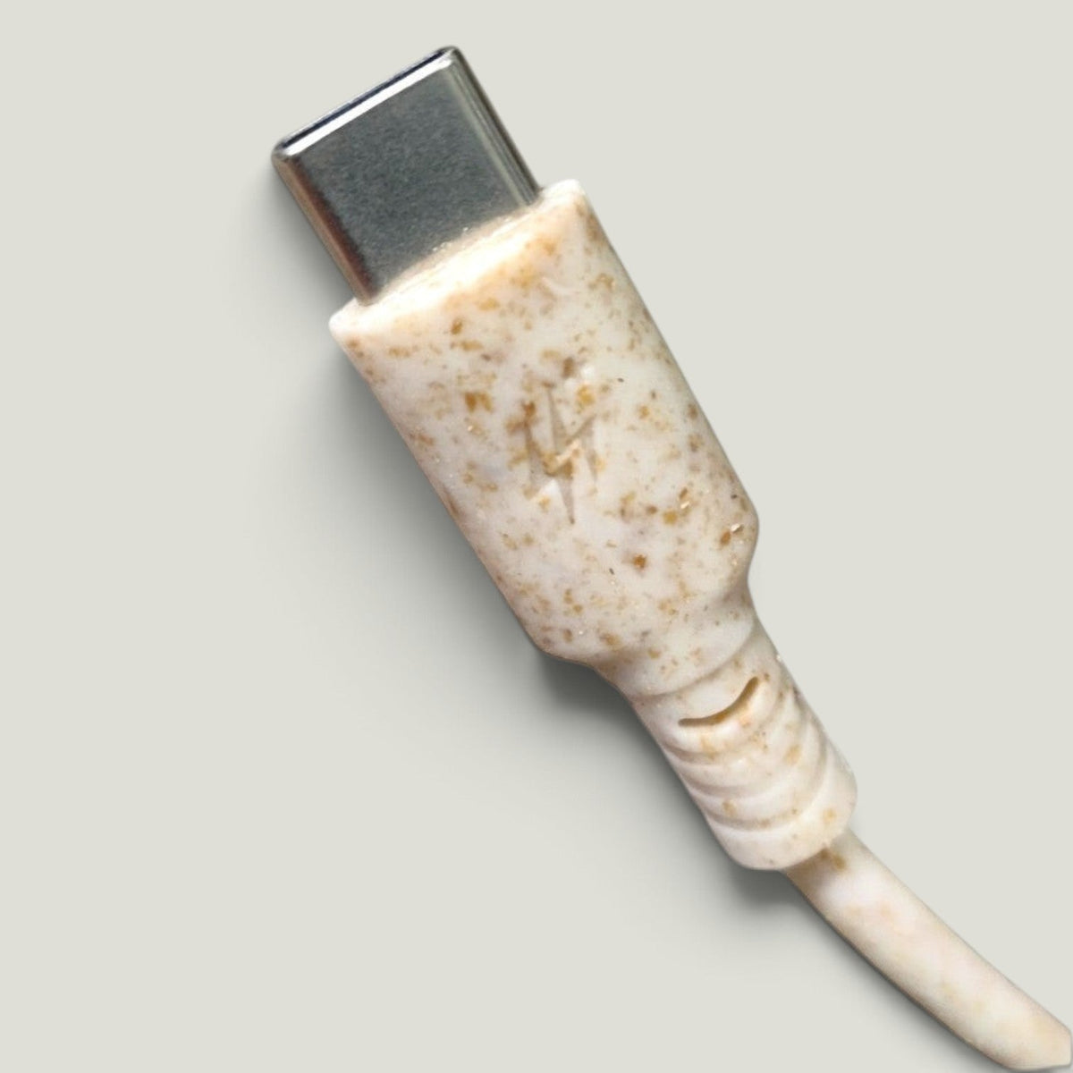 We Pure USB-C cable connector made from eco-friendly speckled wheat straw plastic with a lightning bolt icon